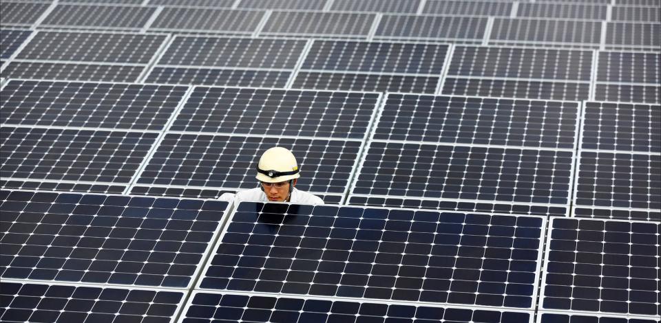 An employee inspecting the photovoltaic power station that ISE, TotalEnergies and SunPower commissioned in Nanao, Japan.